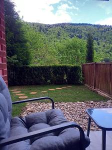 a view of a backyard with a table and a fence at WWA SUNLIGHT VIBES in Sinaia
