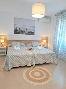 A bed or beds in a room at Villa Las Tres J