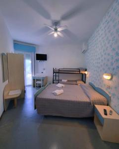 Postel nebo postele na pokoji v ubytování Hotel Roma