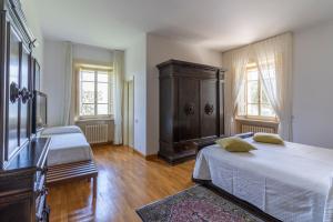 Posteľ alebo postele v izbe v ubytovaní Il Castellaro Country House