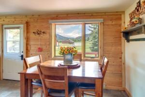 a dining room with a table and chairs and a window at Red Lodge Vacation Rental with Mountain Views! in Red Lodge