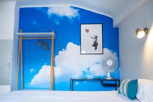 Postel nebo postele na pokoji v ubytování Hotel Le Port Neuf