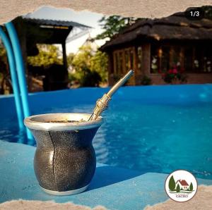 a cup with a spoon in it sitting on a table at La Posada De Cacho in San Rafael