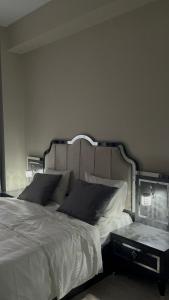 a bedroom with a large white bed and a table at Luxury hotel apartment in Istanbul