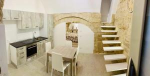 Virtuvė arba virtuvėlė apgyvendinimo įstaigoje Le Mura di Gabry