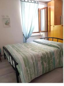 A bed or beds in a room at Fuga in montagna Casa indipendente mezzo montagna con barbecue