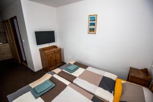 Postel nebo postele na pokoji v ubytování Penzion Avionika
