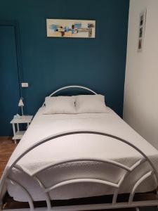 En eller flere senge i et værelse på Gite l'olivier