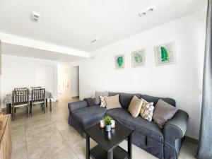 a living room with a couch and a table at Chill Out Tesoro in Adeje