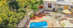 an overhead view of a house with a swimming pool at Villa Damara con piscina privada in Nerja