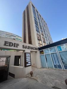 a building with a sign that reads edit sanchez at Apartamentos Aurea in Benidorm