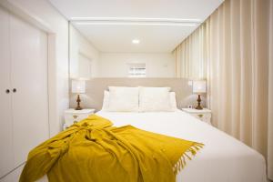Postel nebo postele na pokoji v ubytování Pérola dos Anjos by LovelyStay