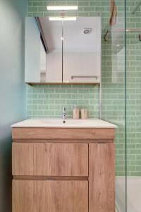 a bathroom with a sink and a glass shower at Comfortable Town House in Quiet Area by LovelyStay in Lisbon +51 photos