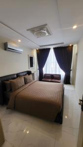 Ένα ή περισσότερα κρεβάτια σε δωμάτιο στο C Suites