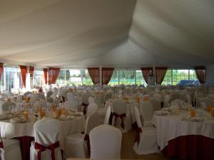 a large marquee with white tables and chairs at Prado de las merinas in Caleruega