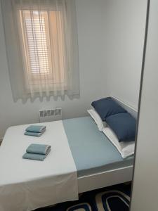 Postel nebo postele na pokoji v ubytování Apartman Luca