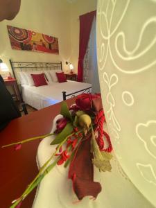 Rúm í herbergi á B&B Alexander
