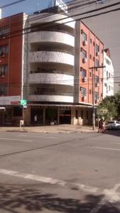 a building on the corner of a city street at Hotel Alvorada in Goiânia
