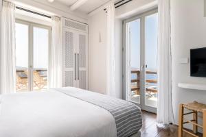 Postel nebo postele na pokoji v ubytování Villa Olivia Mykonos + 37 fotografií