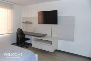 TV o dispositivi per l'intrattenimento presso Aranjuez- Sofisticado apartamento de 1 hab en Usaquén