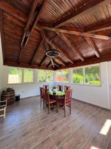 a dining room with a table and chairs at Kuća za odmor Oaza mira in Kovačevo Polje