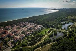 an aerial view of a resort near the water at White Sea - Neptun Park by OneApartments in Gdańsk