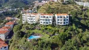 an aerial view of a building on a hill at Tucha's Apartement in São Gonçalo