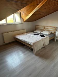 a bedroom with a large bed in a attic at 2 Room 1 bathroom 1 Kitchen 3-4 people in Istanbul