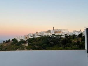 a view of a city with white buildings on a hill at El rincón de Vejer. Vistas exclusivas y únicas. in Vejer de la Frontera