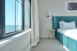 Postel nebo postele na pokoji v ubytování Hotel Moraine