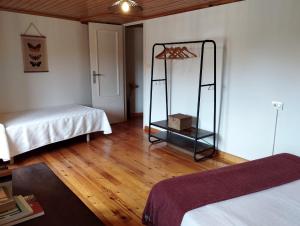 a room with a room with two beds and a mirror at Casa Aldea de Abaixo in Lugo