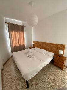 Posteľ alebo postele v izbe v ubytovaní El Olivar Corralejo Beach