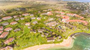 an aerial view of a resort next to the beach at Kiahuna Plantation Renovated 1br, Private Lanai, AC 411 in Koloa