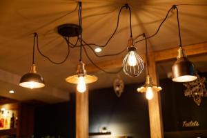 a group of lights hanging from a ceiling at Three Horseshoes, Bubbenhall in Bubbenhall