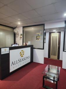 a lobby with a sign that reads allessenossurprises at All Seasons Guest House I Rooms & Dorms in Madgaon