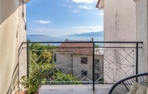 a balcony with a view of the ocean at Nice Apartment In Rijeka With House Sea View in Rijeka