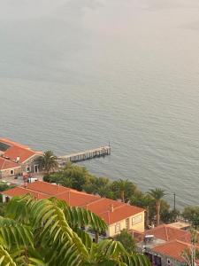 a view of the ocean with a pier and houses at MOLYVOS BOUTIQUE HOUSE in Mythimna