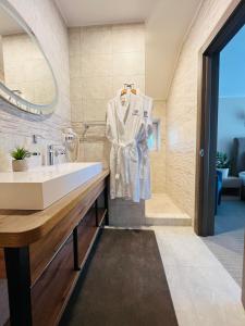 a bathroom with a sink and a mirror at Blueberryhouse in Bukovel