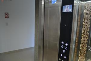 a stainless steel refrigerator with a sticker on it at Calmo Dooneo Appart La Plata - Departamentos con COCHERA in La Plata