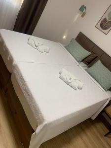 Apartman Antonovic tesisinde bir odada yatak veya yataklar