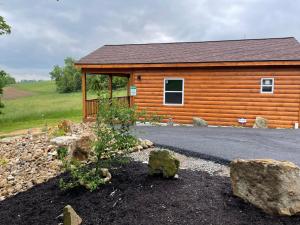 a log cabin with rocks in front of it at Lily Pad Cabin in South Park