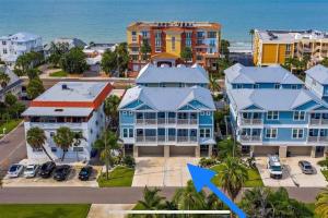 an aerial view of a resort with a blue arrow at Luxurious Modern Townhouse right across beach!! Table Tennis in St Pete Beach