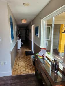 a hallway of a house with an exit sign on the wall at Grantview Inn in Surrey