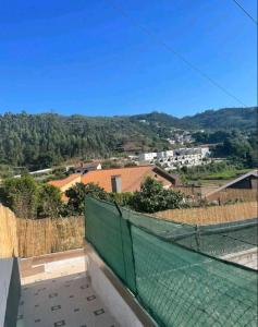 a view of the countryside from the roof of a house at Arrendar braga in Braga