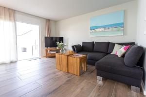 TV a/nebo společenská místnost v ubytování Geiseltalsee Haus am See mit Wallbox
