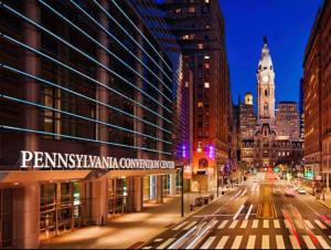 a city street at night with a clock tower at 504 Luxe 1BDR APT in center city in Philadelphia
