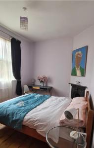 a bedroom with a bed with a glass table at 20 Gray Street in Dublin