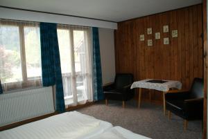 Postel nebo postele na pokoji v ubytování Hotel Pension Spycher