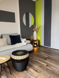 a living room with a couch and a table at Modern Apartment near Munich Airport in Oberding