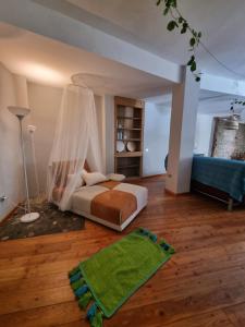 A bed or beds in a room at Borgo Antico Apartments